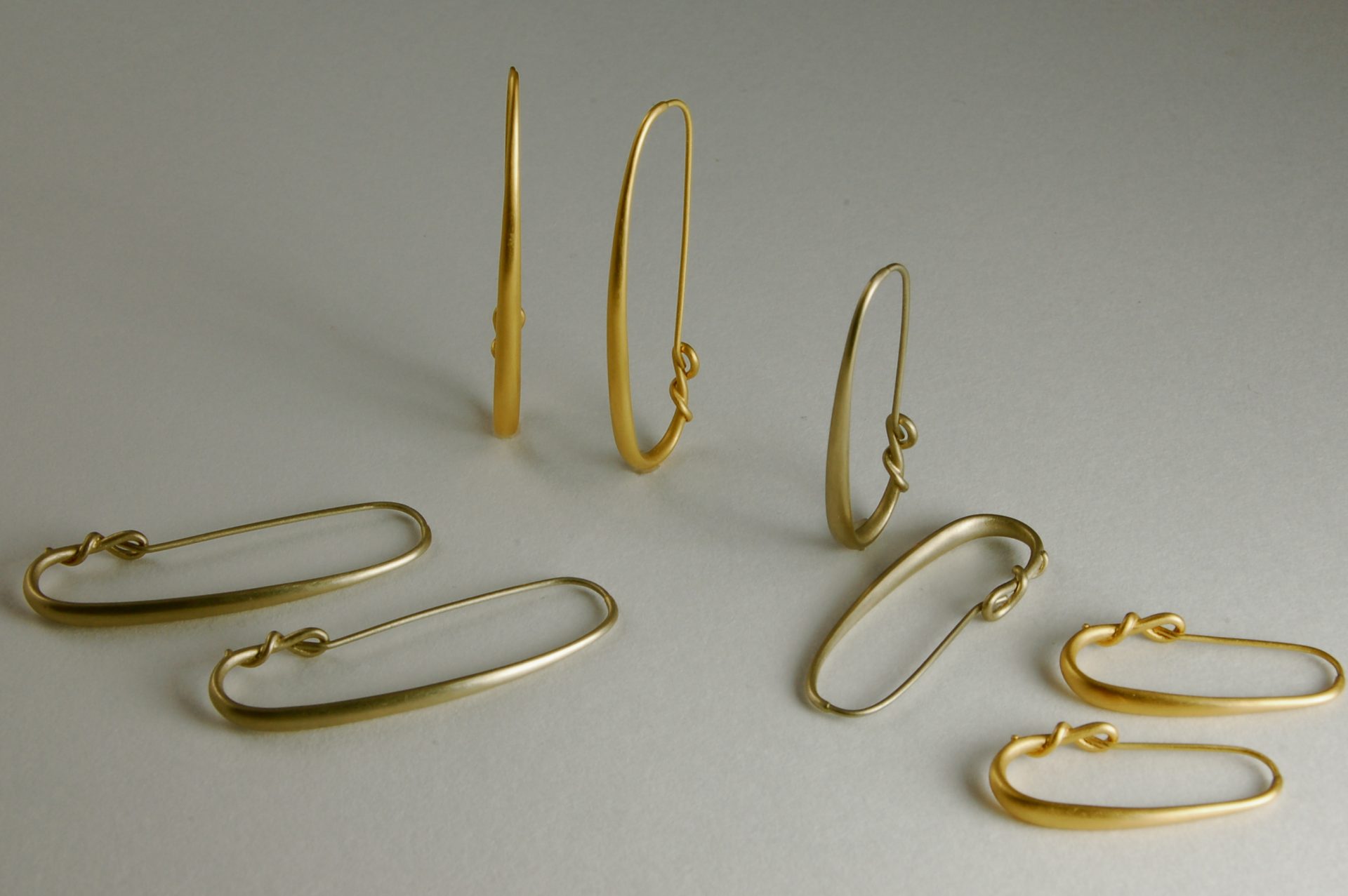 Large and Small Eclipse Hoop Earrings in Yellow and White Gold